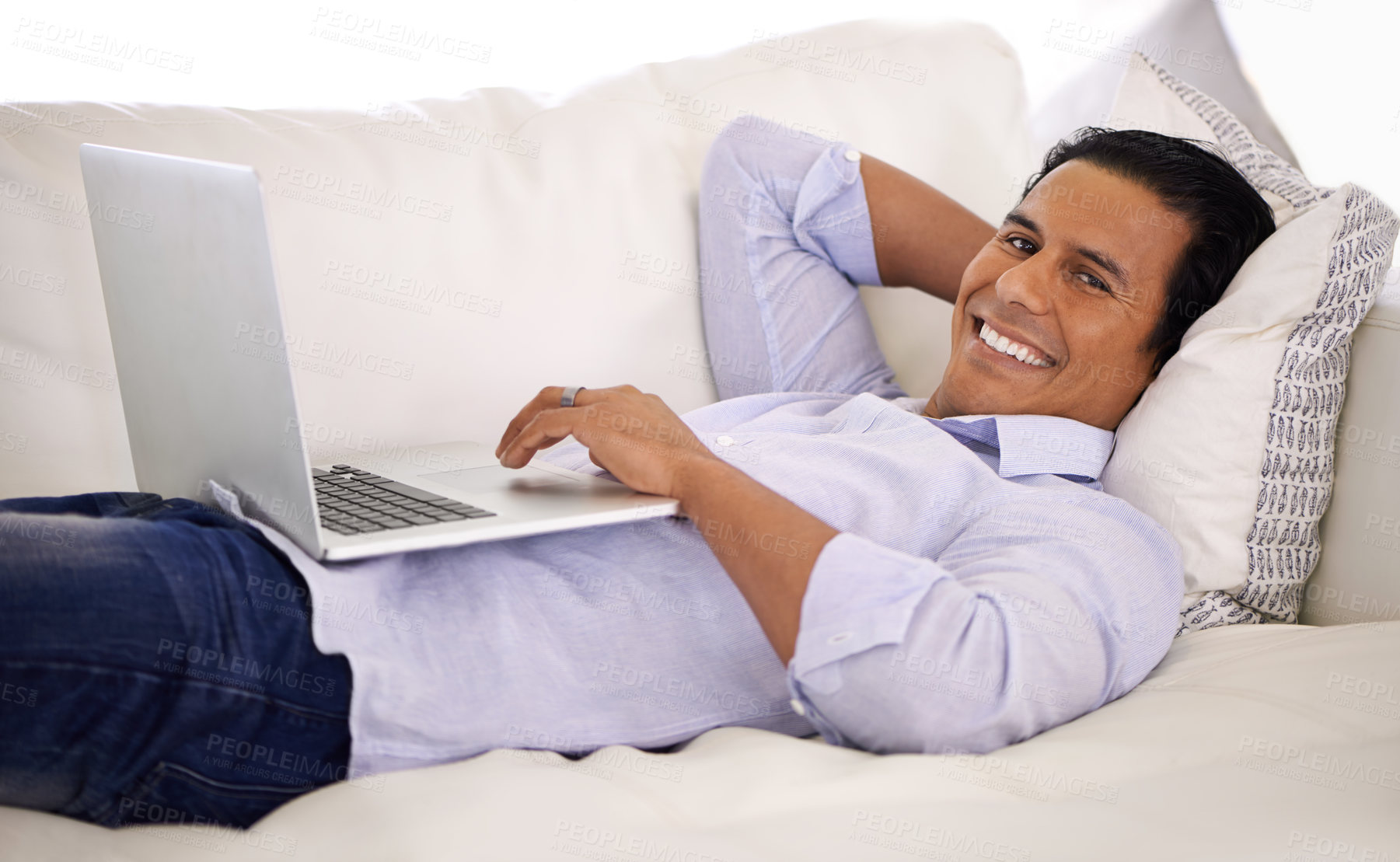 Buy stock photo Happy man, portrait and laptop and relax on sofa for remote work, email or communication at home. Handsome businessman or freelancer with smile on computer and lying on couch in living room at house