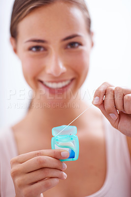 Buy stock photo Portrait, smile and dental floss for oral hygiene care with woman in bathroom of home for teeth whitening. Face, product and happy young person in apartment to prevent tooth decay or gum disease
