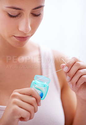 Buy stock photo Dental, health and woman with floss in studio for health, wellness and oral hygiene routine. Treatment, mouth and young female person with product for cleaning teeth isolated by white background.