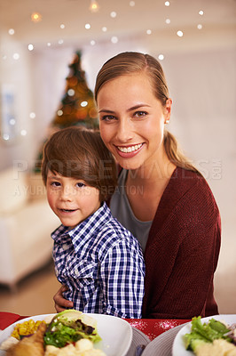 Buy stock photo Mother, kid and portrait with Christmas dinner for celebration, smile and bonding over festive season. Parent, child and together for meal with xmas decoration and holiday with food for family