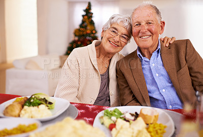 Buy stock photo Christmas, smile and portrait of senior couple in home for dinner, bonding and happy together at party. Xmas, face and elderly man with woman at table, food and love of people on festive holiday
