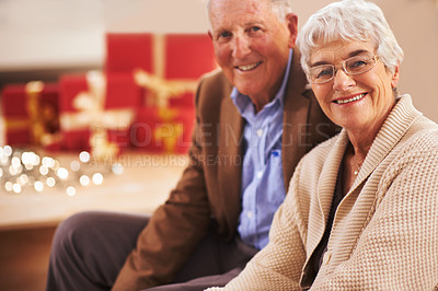 Buy stock photo Elderly couple, portrait and Christmas with gifts or festive season in Canada or vacation, bonding or celebration. Man, woman and face with fairy lights or happy with box package, holiday or together