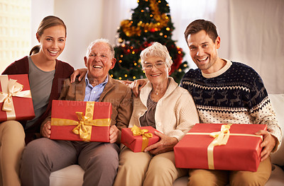 Buy stock photo Grandparents, family with Christmas or portrait for festive season together for celebration, presents or holiday. Elderly man, woman and couch at home in Canada for bonding joy, vacation or relaxing