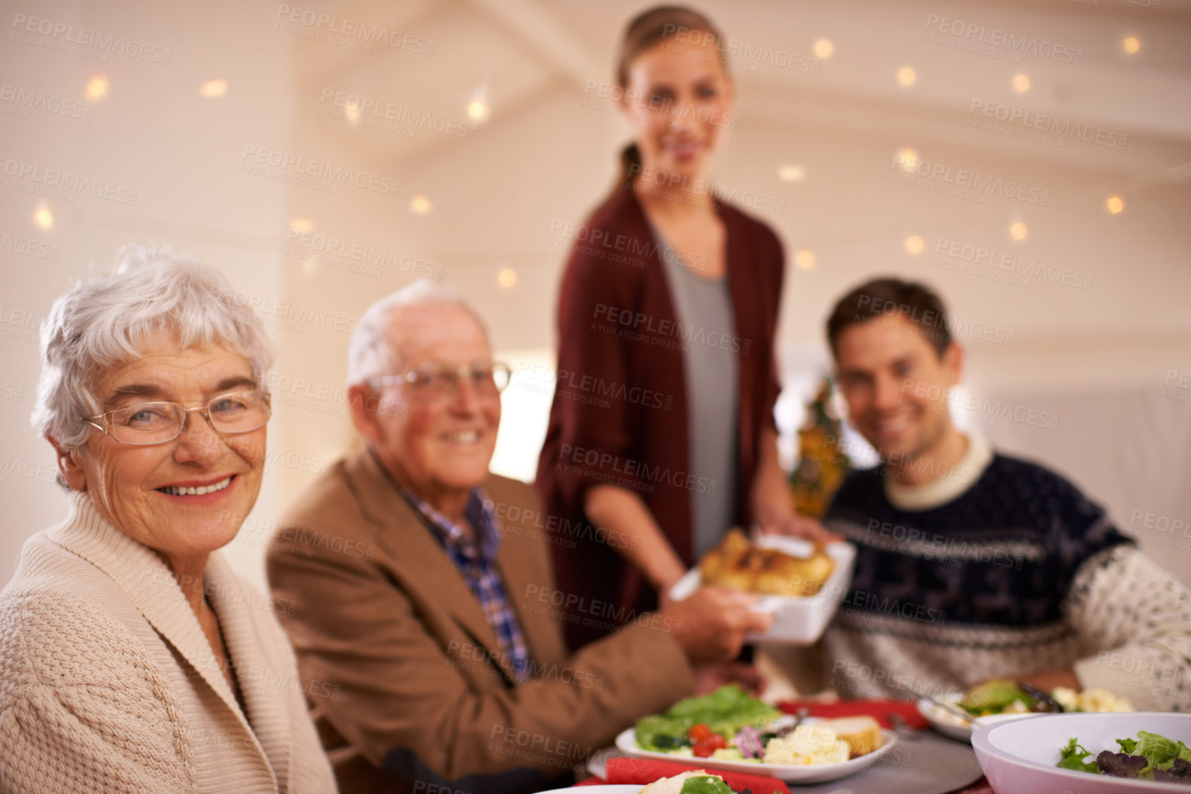 Buy stock photo Grandmother, portrait and family at dinner on Christmas, together with food and celebration in home. Happy, event and people smile with lunch, dish and relax on holiday at table with grandparents