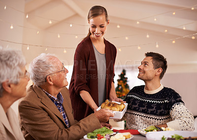 Buy stock photo Family, dinner and smile at table on Christmas, together with food and celebration in home. Senior, mother and father with happiness at lunch with woman hosting holiday and dish of chicken on plate