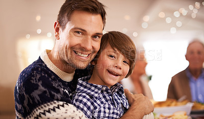 Buy stock photo Portrait of a young father and his son on Christmas day