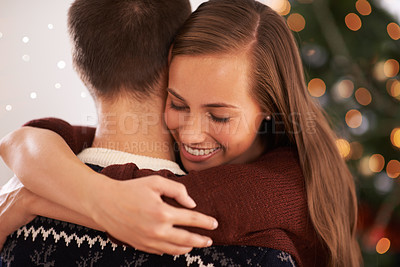 Buy stock photo Home, hug and couple with Christmas, celebration and festive season with marriage or holiday. Apartment, embrace or man with woman or vacation with Xmas or happy with relationship or bonding together
