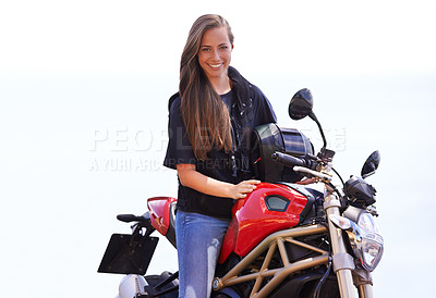 Buy stock photo A beautiful young woman sitting on her red motorcycle