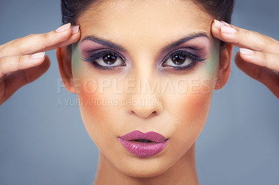 Buy stock photo Creative, makeup and portrait with woman in colorful cosmetics in studio and gray background. Beauty, cosmetics and model with unique identity or rainbow aesthetic with confidence in skincare