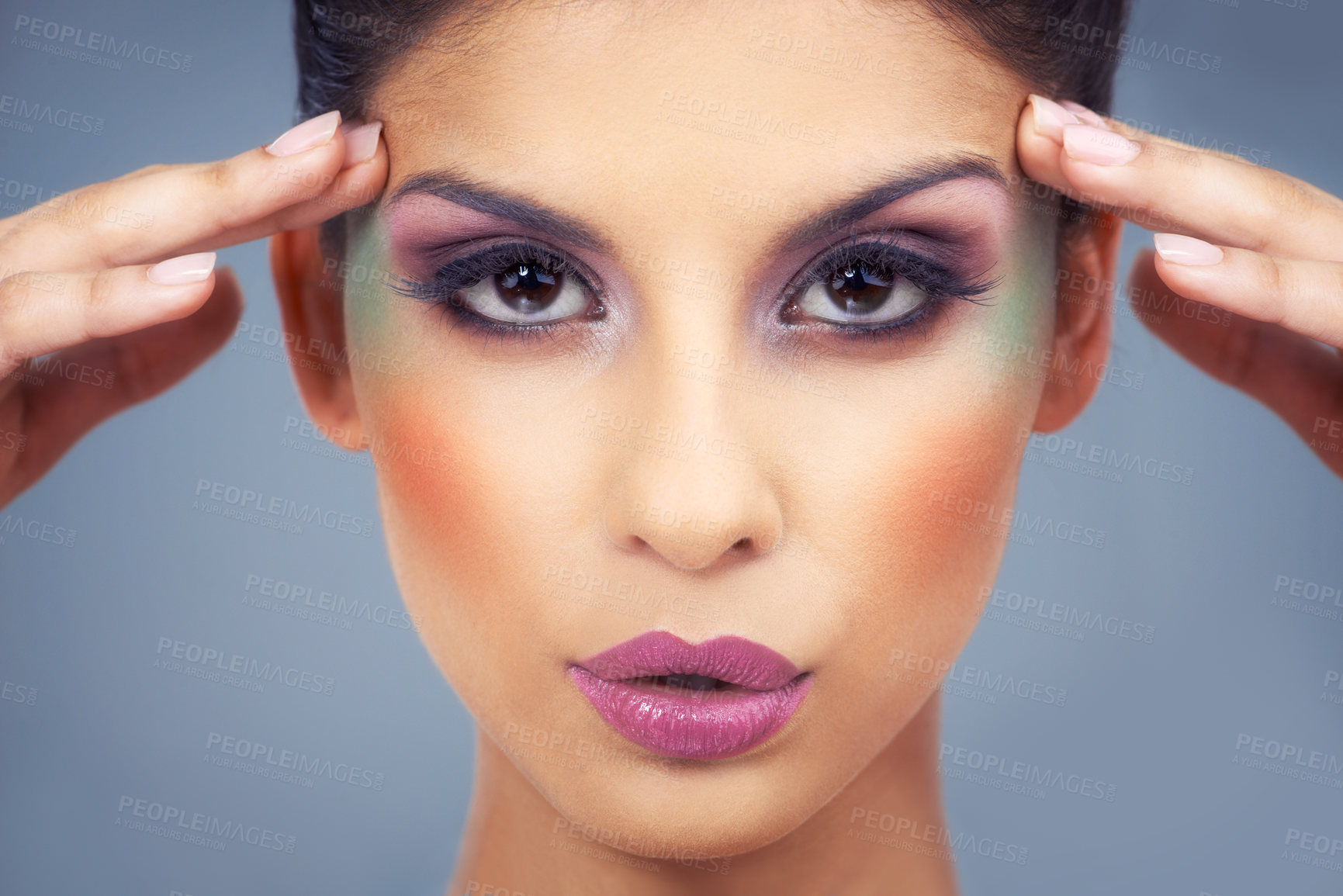 Buy stock photo Creative, makeup and portrait with woman in colorful cosmetics in studio and gray background. Beauty, cosmetics and model with unique identity or rainbow aesthetic with confidence in skincare