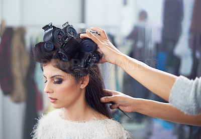 Buy stock photo Woman, hair and makeup with curlers and hands of stylist, cosmetic care and beautician with treatment. Beauty in salon, actor or celebrity backstage with hairdresser and haircare for glamour styling