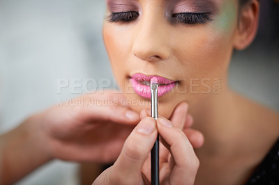 Buy stock photo A young woman having makeup applied