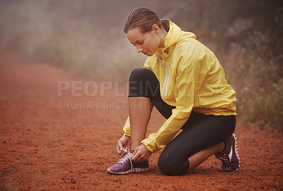 Buy stock photo Running, shoelace and fitness woman in park for training, exercise or wellness in winter. Workout, sneakers or runner in nature for morning cardio preparation, sports or shoes check for marathon run