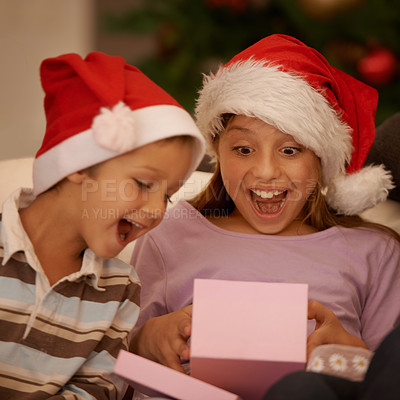 Buy stock photo Wow, children and surprise with a Christmas gift for tradition, celebration or festive joy in their home. Siblings, box and kids in living room unboxing present for holiday, event or package in house