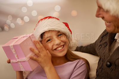 Buy stock photo Christmas, sofa and portrait of child with gift box, dad and celebration together with happy surprise. Holiday, father and daughter smile on couch for present giving, festive xmas and love in home.