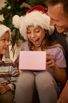 Buy stock photo Christmas, tree and excited children with gift box, dad and celebration together with happy surprise. Holiday, father and kids smile in living room for present giving, festive xmas and love in home.