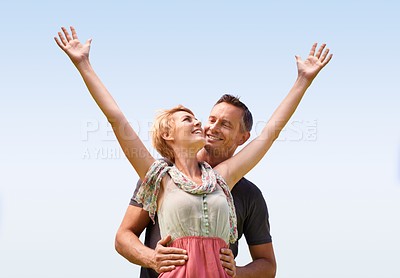 Buy stock photo Couple, freedom and smile with love outdoors for honeymoon vacation, together and arms up for freedom. Man, woman and relationship with care for romance, marriage and support with trust for happiness