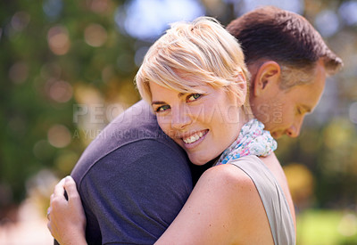 Buy stock photo Hug, love and couple in nature with support, commitment and trust, care and solidarity while bonding in a park. Safety, security and people embrace in a garden with peace, calm or soulmate connection
