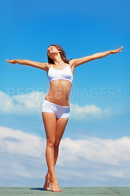 Buy stock photo Blue sky, stretching arms and body of woman in underwear for fitness, freedom and achievement of health goals. Mockup, happiness and model on roof with sunshine space, healthy mindset and celebration