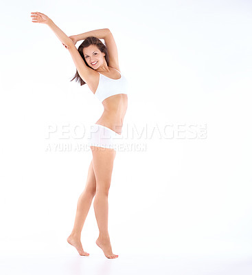 Buy stock photo Studio shot of a beautiful young woman in her underwear isolated on white