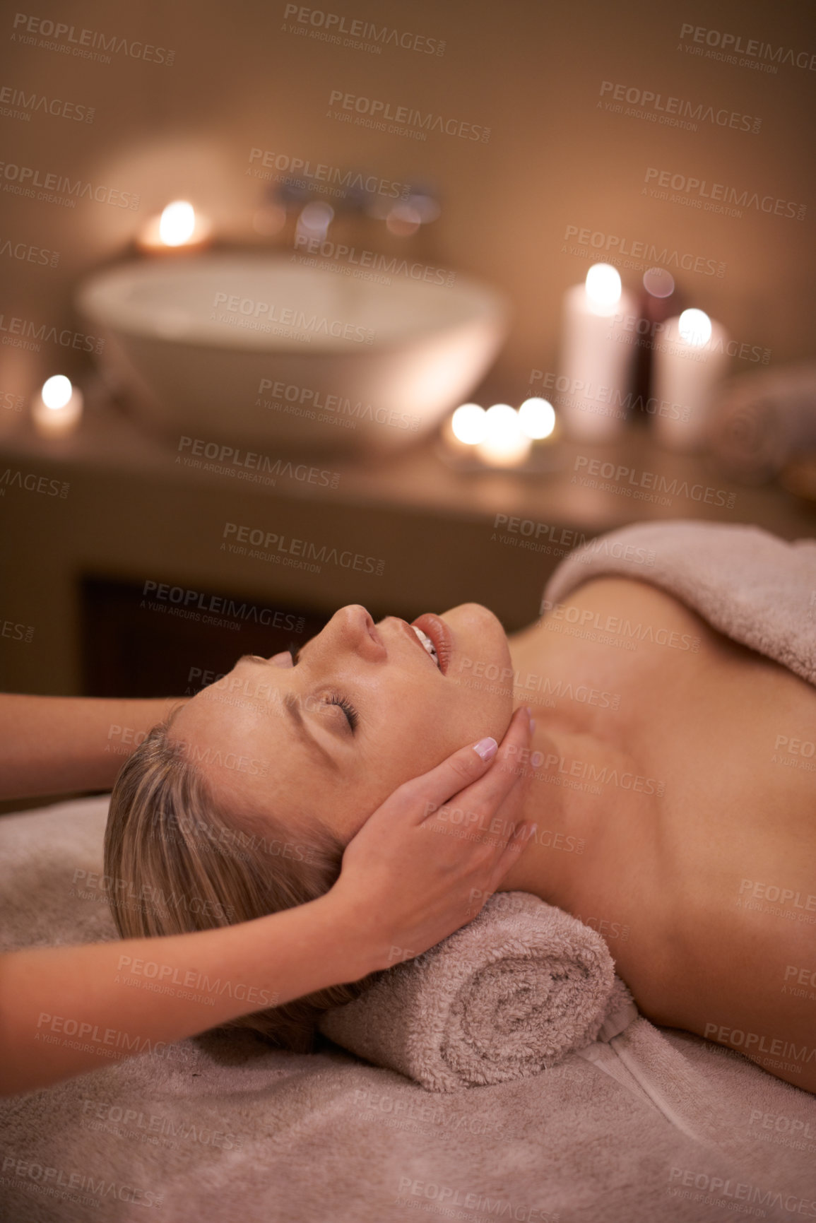 Buy stock photo Face massage, spa and relax with woman, beauty and candles with hospitality and stress relief. Person, facial and girl with wellness or healthy with vacation or peace with holiday, detox or self care