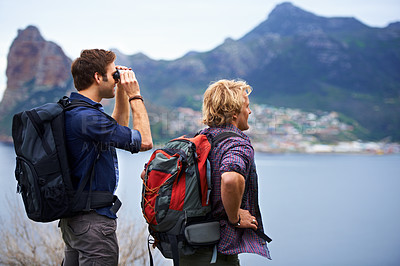 Buy stock photo Two male backpackers admiring a great view