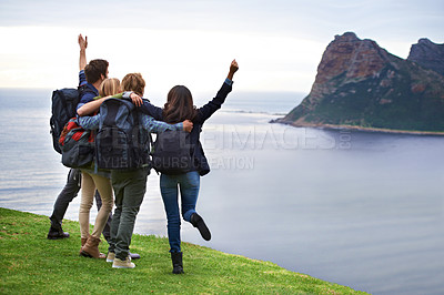 Buy stock photo A group of young people admiring the view together