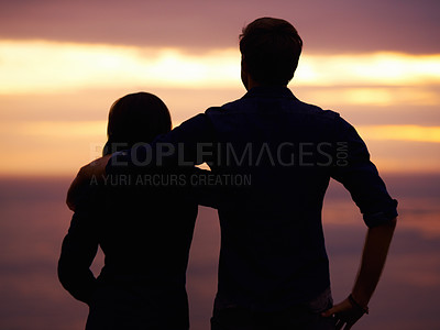 Buy stock photo Back, sunset and couple hug with silhouette, view outdoor with nature and travel together for love and bonding. Adventure, journey and people in environment, orange sky with support and trust