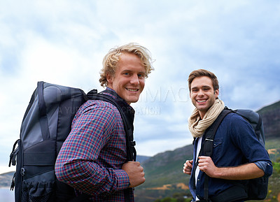 Buy stock photo Happy man, portrait and friends with backpack for hiking mountain, travel or sightseeing on outdoor journey in nature. Male person or young hikers with bag on back for trekking, fitness or adventure