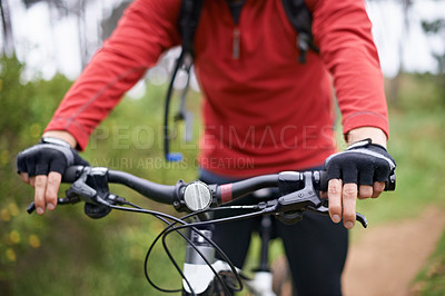 Buy stock photo Hands, bike and cyclist person in countryside for fitness, health or off road hobby closeup. Exercise, sports and training with athlete holding handlebar for cycling on path or trail in nature