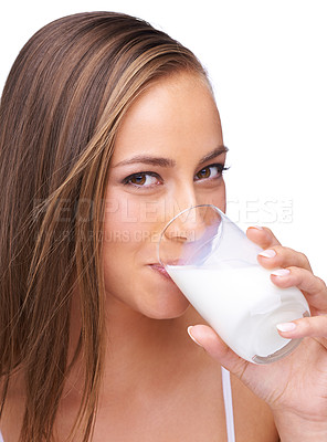 Buy stock photo Portrait, milk drink and happy woman in studio, isolated white background or healthy diet. Face of female model, glass and fresh dairy for breakfast, protein and calcium, organic wellness or vitamins