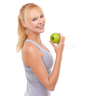 Buy stock photo Studio portrait of an attractive blonde woman holding an apple