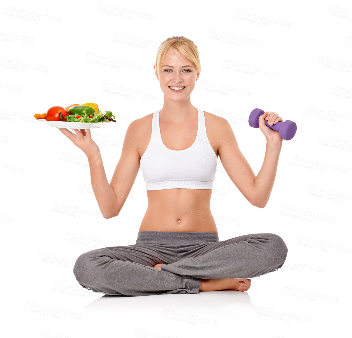 Buy stock photo Portrait of a beautiful young woman holding a salad in one hand and a dumbbell in the other