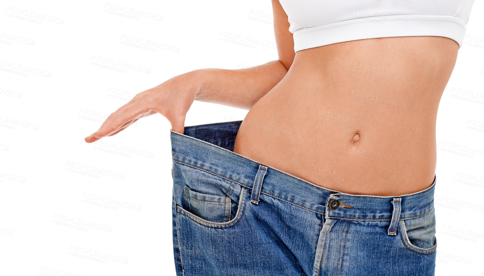 Buy stock photo Body, health and woman with big pants in studio for weight loss, fitness or exercise results. Wellness, diet and closeup of female person with jeans for measuring slim stomach by white background.