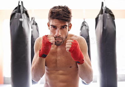 Buy stock photo Boxer, gym and portrait for fitness, exercise and wellness in strong training for confidence to fight. Man, sport and boxing athlete in training, challenge and shirtless ready to punch for kickboxing