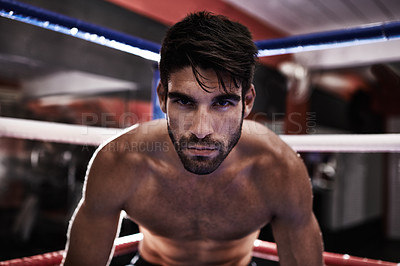 Buy stock photo Fighter, determined and man ready in ring for challenge, competition and training for strength in gym. Male person, healthy and fitness from practice in exercise studio as athlete of sport and MMA