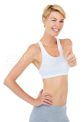 Buy stock photo Portrait, wink and woman with thumbs up for fitness with emoji isolated on a white studio background. Smile, sport and person with like hand gesture for success, exercise and workout for healthy body