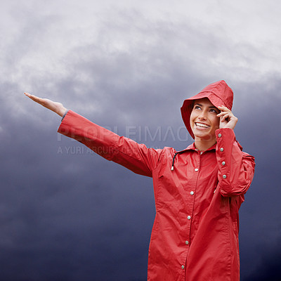 Buy stock photo Rain coat, woman and smile with weather, outdoor and freedom with break and travel. Person, nature and girl with cover and carefree with joy and storm with fog and wet with water, happy and overcast