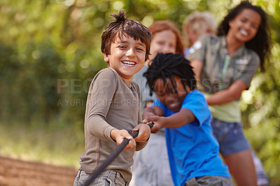 Buy stock photo A group of kids in a tug-of-war game