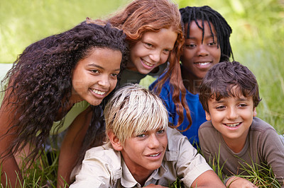 Buy stock photo Friends, smile and group of children in field together for summer camp, adventure or outdoor fun. Diversity, grass and nature with happy young kids in park for bonding, leisure or recreation