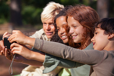 Buy stock photo Shot of a group of children taking a self-portrait outdoors