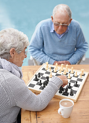 Buy stock photo Chess, strategy and old couple thinking while playing a board game in the backyard or bonding together. Mind, relax or challenge with an elderly man or senior woman in the garden for problem solving 