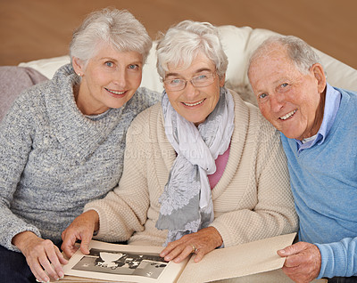 Buy stock photo Old people, portrait and photo album or memory nostalgia in retirement or together, photograph or connection. Elderly man, women and picture book in home in Canada or bonding, remember or friends