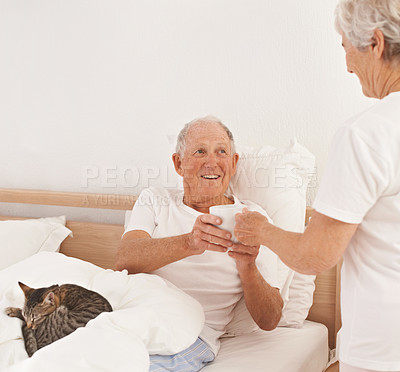 Buy stock photo Senior couple, serving and coffee in bed, smile and relaxing together in retirement at home. Elderly people, bedroom and drinking tea in marriage or relationship, cat and bonding for love on weekend