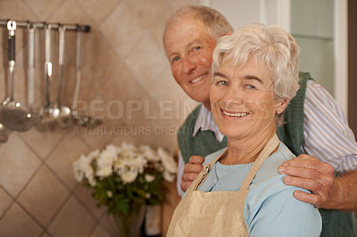 Buy stock photo Couple, elderly and portrait with smile in kitchen for love, bonding and cooking together in home for anniversary. Happy, man and woman in house for commitment, retirement and dinner for enjoyment
