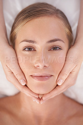 Buy stock photo Woman, above and face at spa for massage, skin care and wellness with hands, facial and portrait. Healthy, female person and top view for beauty, wellbeing and detox for rest, calm and relax