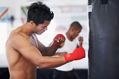 Buy stock photo Punching bag, man and boxing fitness with at a gym for training, resilience or performance training. Sports, body and male boxer profile with punch practice for strength, energy for fighting exercise