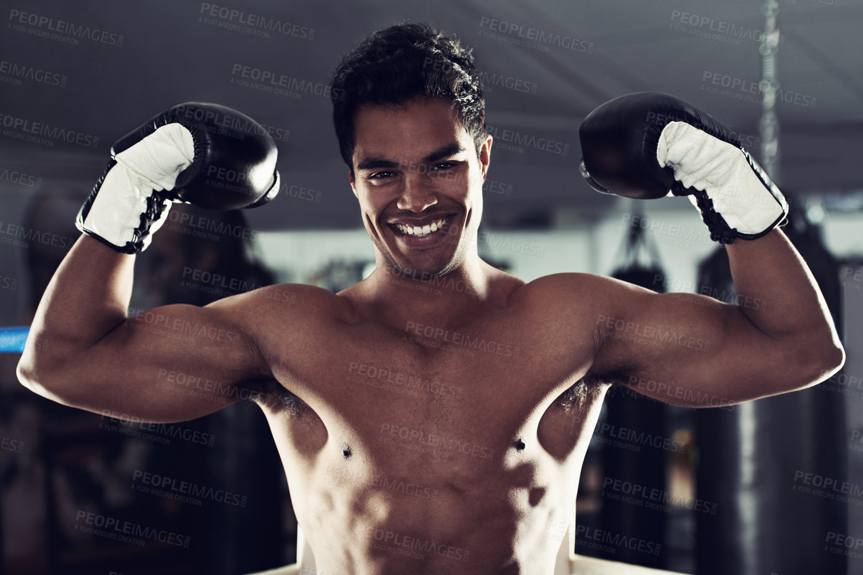 Buy stock photo Boxer, portrait and gym with flex, boxing ring and smile for workout or training. Man, exercise and fitness for health, wellness and achievement or winning with celebration for professional fight