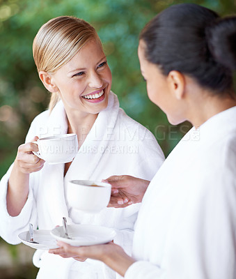 Buy stock photo Spa, friends and happy women drinking coffee for health, wellness and skincare treatment. Girls, tea cup and salon  for beauty, luxury body therapy in bathrobe and diverse people relax together