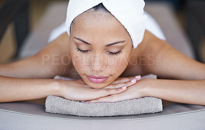 Buy stock photo Young woman, relax or sleeping in spa on massage table, beauty or wellness for body treatment in salon. Person, rest and zen for health at luxury resort, calm and comfort for stress free on holiday